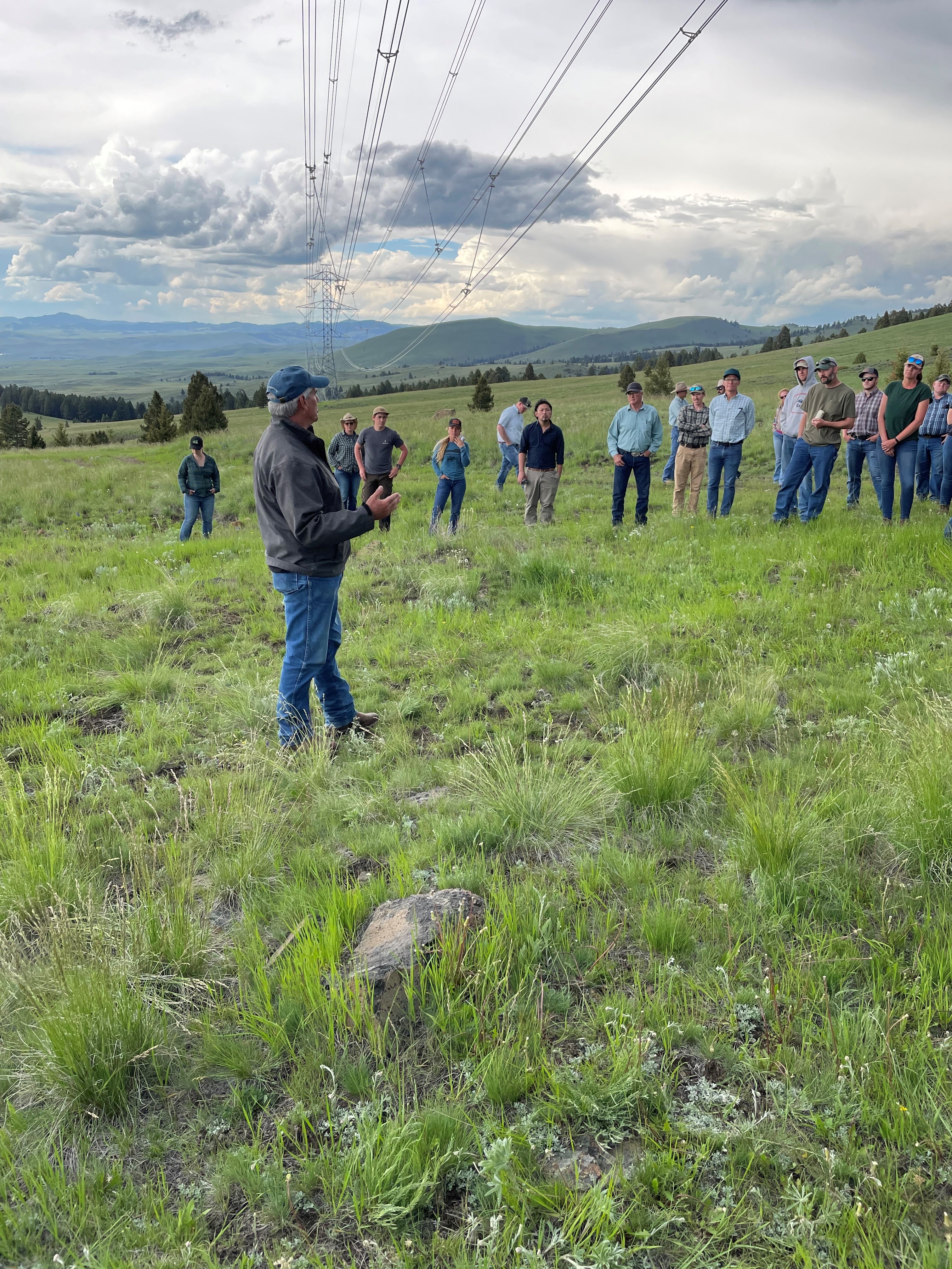 MSU Extension Range Specialist Jeff Mosley speaks to a tour group about range management.